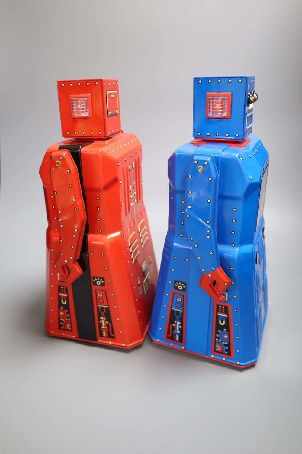 Rocket USA, a rare limited edition 2001 Red R-1 Robot with Black Band, No. 15/34 and a blue version of the R-1 Robot,